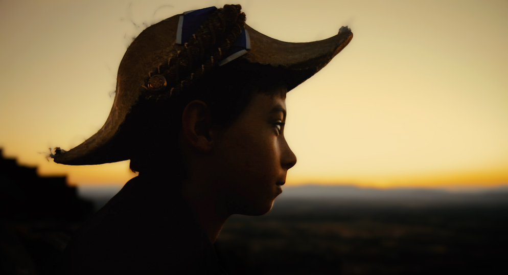 Silhouette of boy at sunset from the film "The Land of Nod" directed by Joshua Dylan Mellars.
